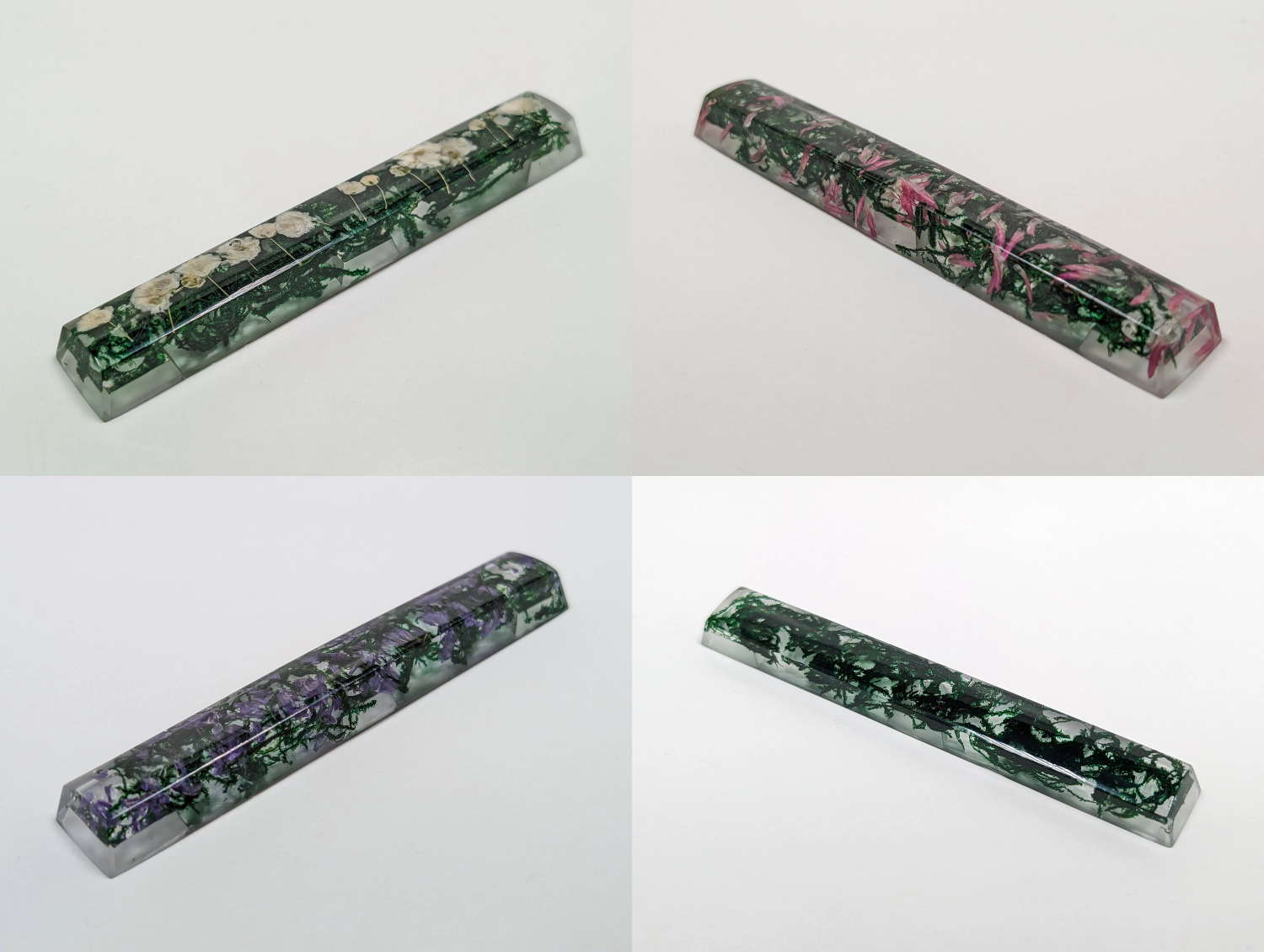 Resin spacebar including moss and flowers